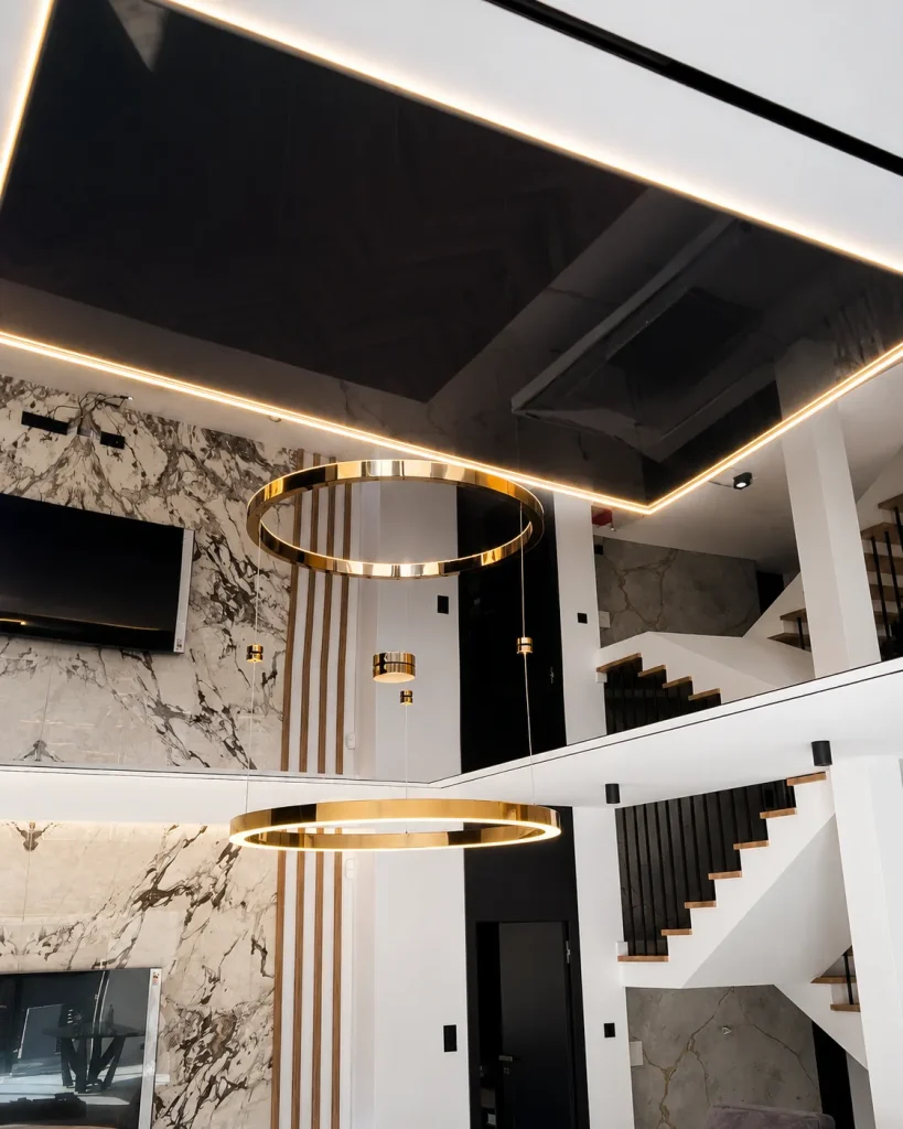 Mirror stretch ceiling with chandelier reflection in a luxury interior