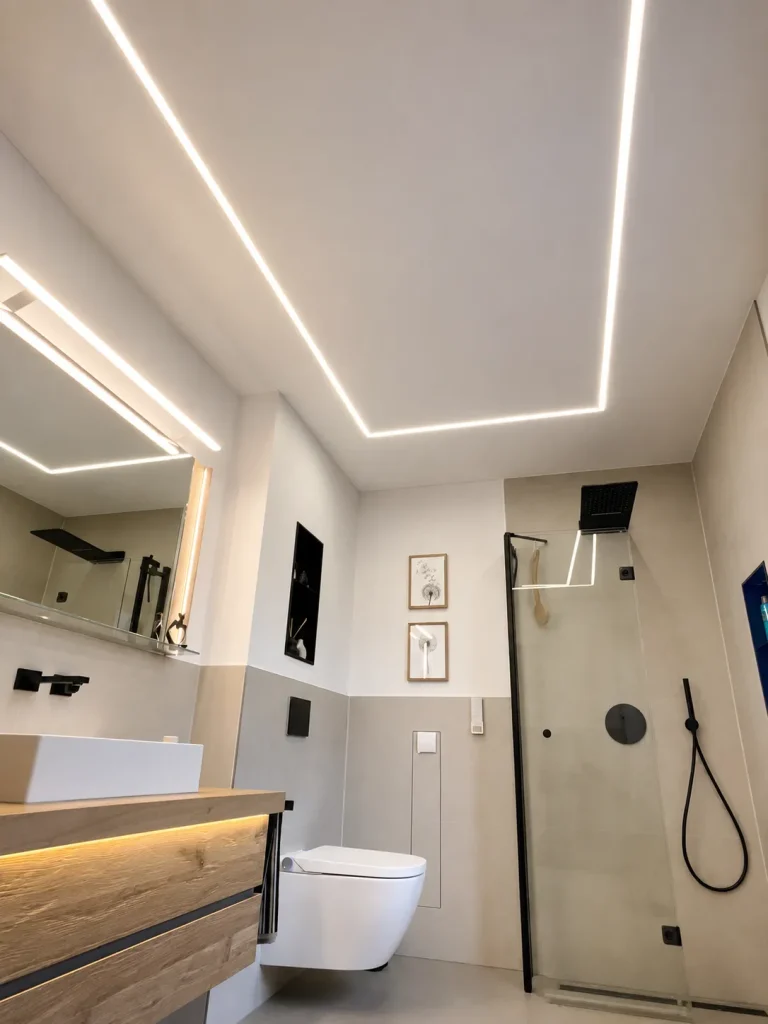 Carve stretch ceiling with decorative LED lighting in a modern bathroom