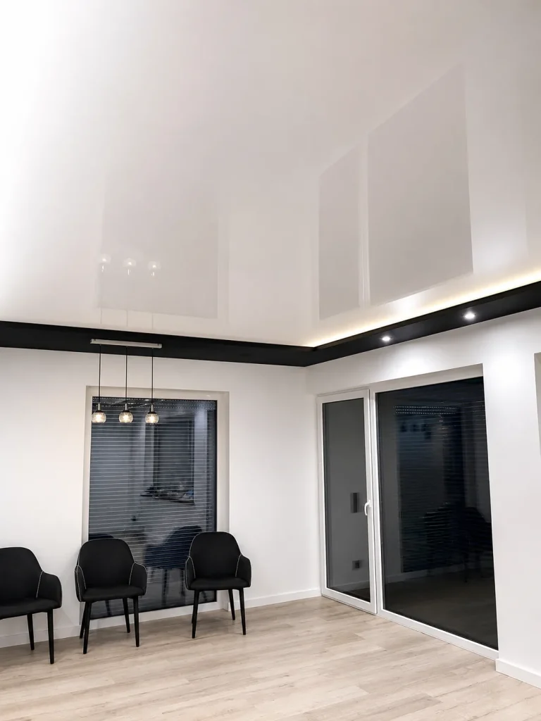 Glossy stretch ceiling with LED perimeter lighting in a modern Kent interior