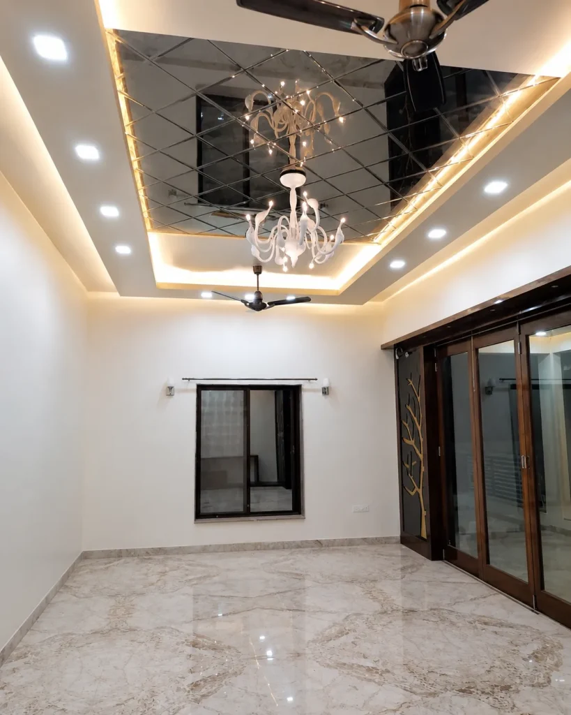 Close-up of mirror stretch ceiling panels with reflective surface and grid structure