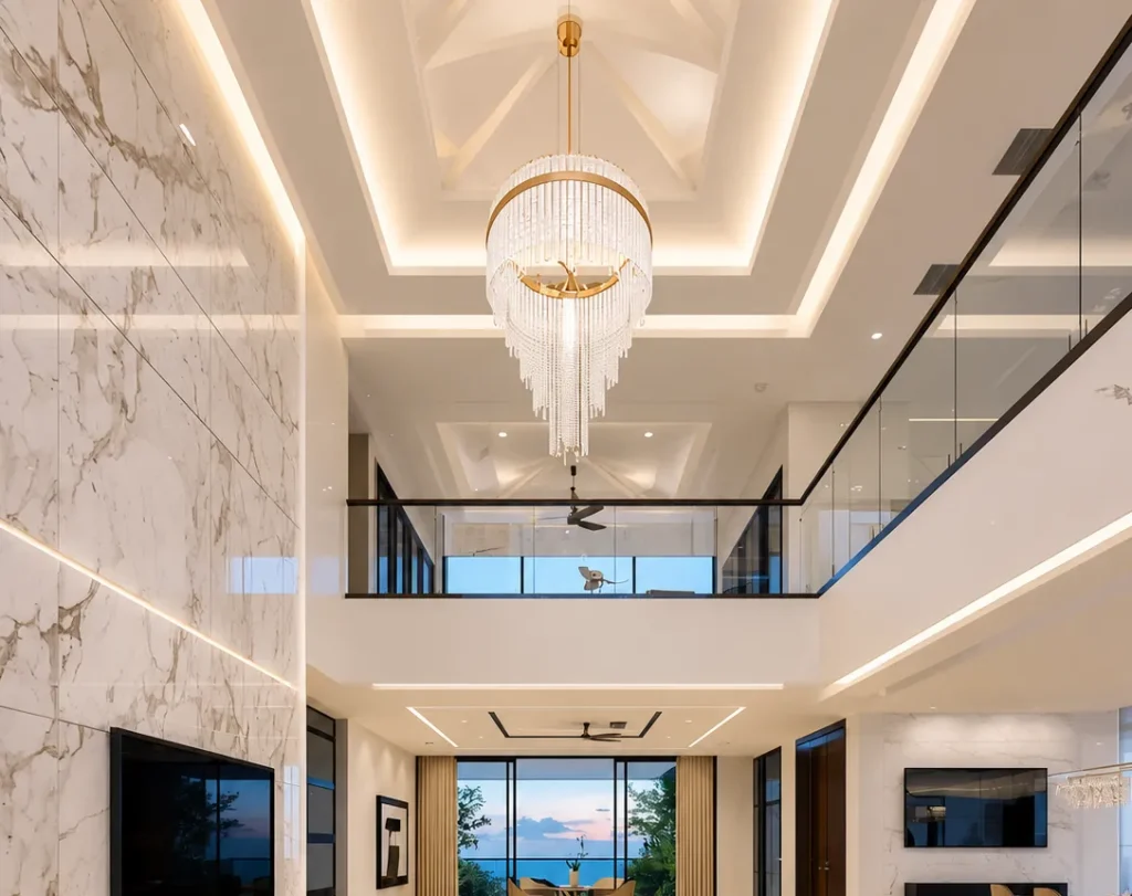 Multi-level stretch ceiling with chandelier and warm LED lighting in a double-height luxury living room