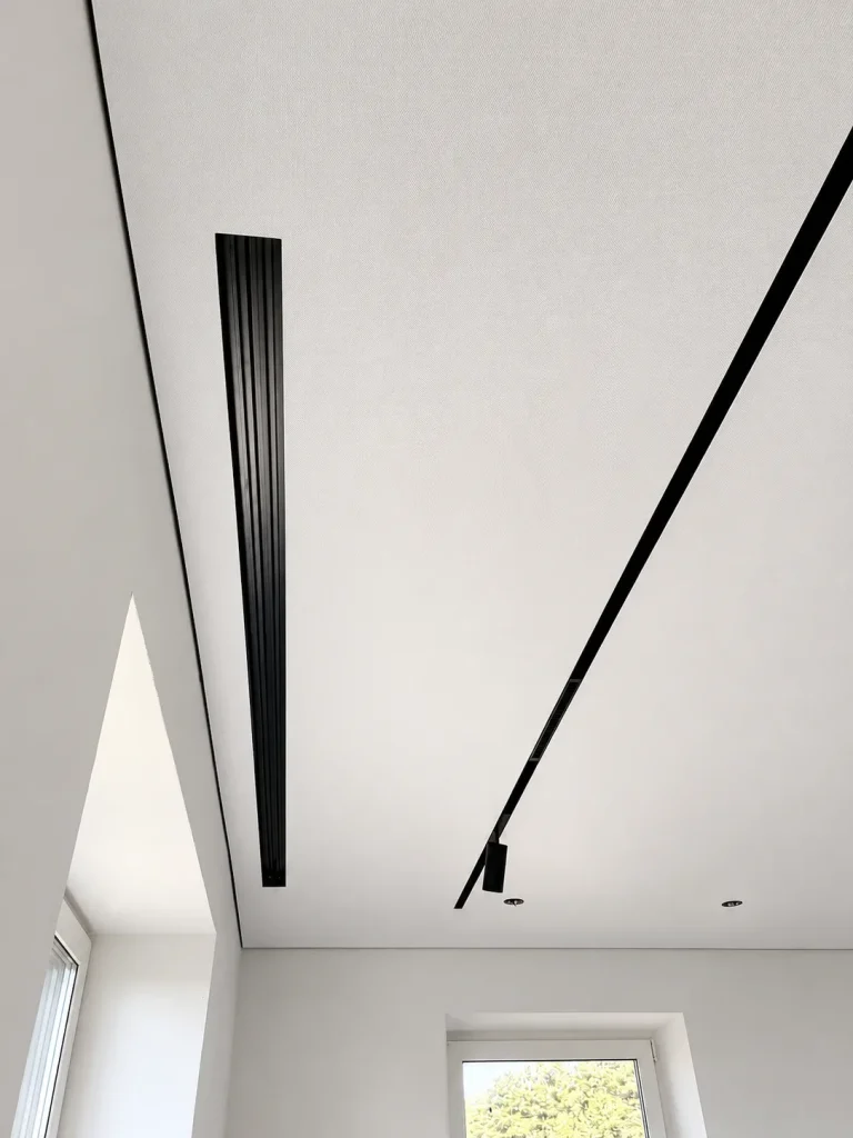 Shadow stretch ceiling with black perimeter gap and linear ceiling detail in a London interior
